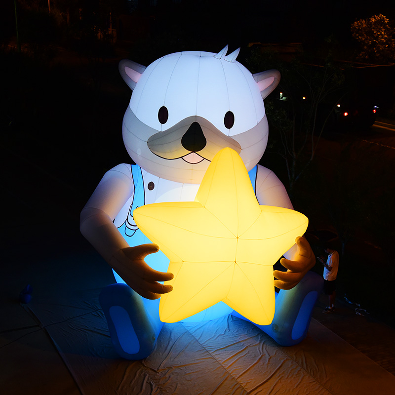 Huge Bear Holding a Star Inflatables Advertising Mascot